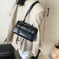 Classic black large capacity underarm bag in glossy leather with bell pendant charm - With Charm / Black