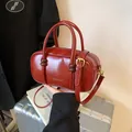 Glossy red faux leather small square handbag with dual handles and golden hardware - No Pendant / Red