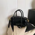 Glossy black bowling bag with gold hardware and logo for casual commute look - No Pendant / Black