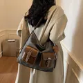 Large dark grey canvas tote bag with leather pockets and brown bear charm worn on shoulder - With Charm / Dark Brown