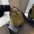 Olive green canvas shell-shaped crossbody bag with black handles and double zippers - Army Green