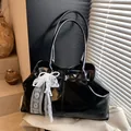 Chic black patent leather tote bag with white lace bow and pearl accessory detail - With Pendant / Black