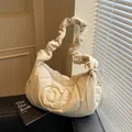 Chic beige quilted dumpling bag with ruched shoulder strap and ribbon detail - 42x14x23 / Off-white