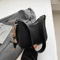 Black lychee texture hobo bag with wide shoulder strap and cute rabbit pendant - 24x7x20.5cm / Black And Rabbit Charm