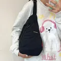 Classic black crossbody chest bag with adjustable strap and metal logo for casual wear - Black