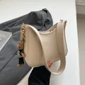 Beige lychee leather crescent shoulder bag with cute brown bear charm accessory - 24x7x20.5cm / White And Rabbit Charm
