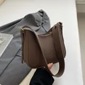 Chic dark brown lychee leather hobo bag with gold hardware and wide shoulder strap - 24x7x20.5cm / Brown