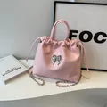 Pink pleated cloud bucket bag with silver bow accent and metallic chain strap - Pink