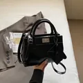 Elegant black PU leather handbag with silver twist lock and mini triangle pouch - Black