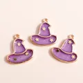 Macro shot of purple witch hat charms with gold stars and glitter for jewelry making - Purple