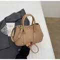 Minimalist khaki bucket bag with lychee grain leather and metal buckle detail - Khaki No Pendant