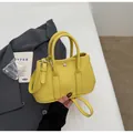 Minimalist bright yellow leather bucket bag with top handles and silver buckle detail - Yellow Without Pendant