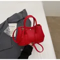 Chic red lychee-textured bucket bag with top handles and adjustable shoulder strap - Wine Red Without Pendant