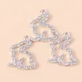 Drie zilverkleurige konijnenhangers met heldere strass steentjes en ophangogen - Zilver