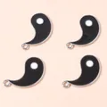 Macro detail of black and white Yin Yang enamel pendants with silver metal plating for DIY - Silver Black