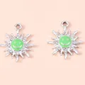 Detailed view of silver flower charms with green enamel smiley faces and small rhinestones - Silver Green