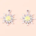 Macro detail of silver sun flower pendants with yellow enamel smile and sparkling rhinestones - Silver & Yellow