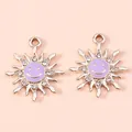 Detail of golden sun pendants with purple enamel smiling faces and crystal rhinestones - Gold Purple