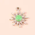 Macro detail of sun flower pendant with green enamel smiley face and sparkling crystals - Gold Green