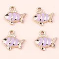 Macro view of four purple striped enamel tropical fish charms for DIY keychains - 10 Pieces/Pack / Gold Purple