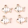 Set of four gold-plated alloy fish charms with white enamel coating and metal rings - 10 Pieces/Pack / Gold White