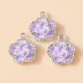 Close-up of purple enamel rose charms with sparkling rhinestones and silver metal base - Silver Purple