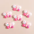 Detail van kleurrijke hars vlinders met stippen voor DIY telefoonhoesjes decoratie - Wit