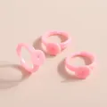 Detailed view of pink adjustable plastic ring bases with flat pads for DIY jewelry making - Pink