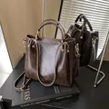 Deep brown vintage leather tote bag with round handles and adjustable gold chain strap - Basic Style / Brown