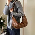 Brown soft leather croissant shoulder bag with pleated texture and vintage moon shape - Brown