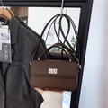 Dark brown lychee pattern leather satchel with silver twist lock and adjustable strap - 23*6*14 / Brown