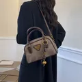 Vintage marble-textured brown bowler handbag with a leather handle and woven charm - 21*7.5*14 / Coffee with Pendant