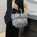 Metallic silver puffer tote bag featuring quilted padded design and adjustable strap - Gray
