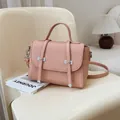 Morandi pink leather handbag with vertical embossed texture and silver metal hardware accents - Pink