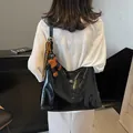 Glossy black hobo tote bag with a cartoon puppy charm and silk scarf decoration - Black With Pendant