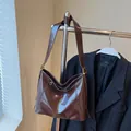 Dark brown high-capacity shoulder bag in glossy leather finish for commuting - Coffee