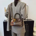 Retro chocolate brown leather pillow bag with double handles and adjustable strap for women - With Pendant / Brown
