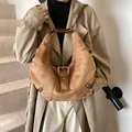Vintage hobo shoulder bag in camel suede finish with decorative silver buckle - Brown