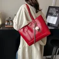 Large red glossy tote bag in oil wax leather finish with gold hardware and charm - With Pendant / Red