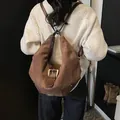 Retro brown suede shoulder bag with vintage metal buckle and adjustable straps - Brown