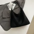 Minimalist black suede Hobo bag with large capacity and matte finish shoulder strap - Black without Pendant