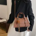 Brown leather tote bag with BAIDESHIJIA logo and cute teddy dog charm on shoulder strap - Standard Spec / Brown with Pendant