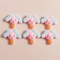 Close-up of cute puppy ice cream resin charms for DIY hair accessories and crafts - Pink