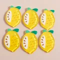 Flat lay of cute cartoon lemon resin charms with glitter for DIY handmade phone cases - Yellow