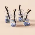 Detail showing mini milk tea cup charms with blue star glitter for DIY jewelry making - Blue Fruit Cup