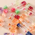 Mini glass cylinder pendants with colorful dried flowers and metallic eyelet hooks - Multicolor