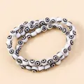 Macro shot of double-strand evil eye resin beads for DIY jewelry making and necklace crafts - Black & White