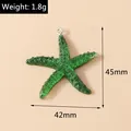 Green resin starfish pendant measuring 42mm x 45mm with silver loop and glitter detail - Dark Green