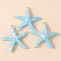 Three blue resin starfish charms with glitter and silver rings for DIY jewelry making - Sky Blue