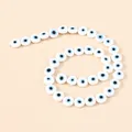 Colorful 10mm resin evil eye beads arranged in a spiral for DIY jewelry making - 35 Pieces Set / White and Blue